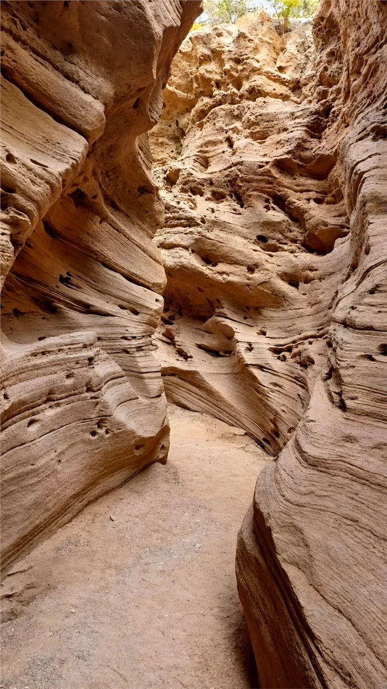 Layered sandstone canyon passage near the Timlaline dunes