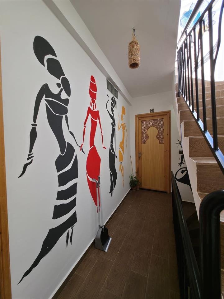 Artistic mural painting in Dar Mouja hallway