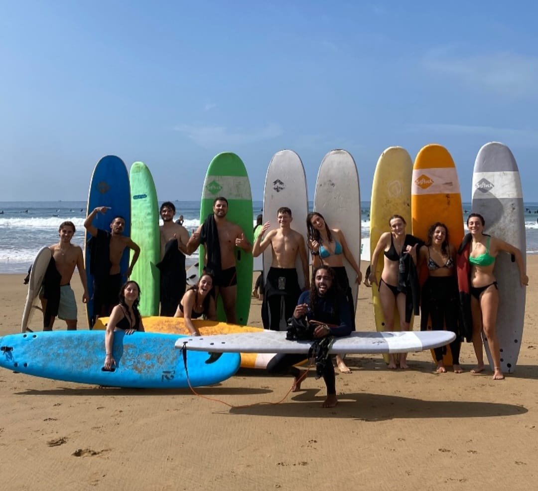 Surf group on Morocco's Atlantic coast, matching the Agadir and Taghazout excursion spirit